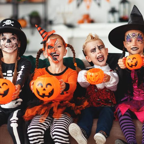 happy-halloween-a-group-of-children-in-suits-and-royalty-free-image-1630407577-min